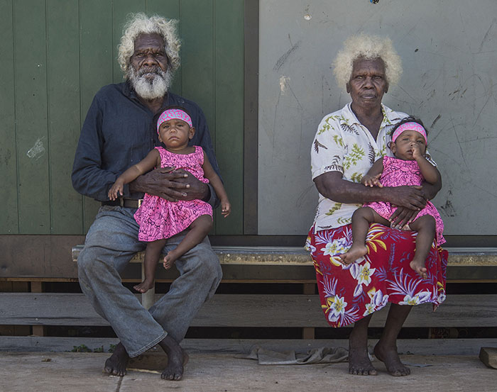 'Generations Aurukun' - Fin almost Fremantle Portrait Prize 2019 - image of Aurukun elders Silas and Rebecca Wolmby with their great grand children - Shalona and Keola Wolmby by Brian Cassey